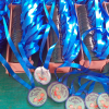 Produccion por mayor de medallas de acrilico personalizadas en taller Filingraf.